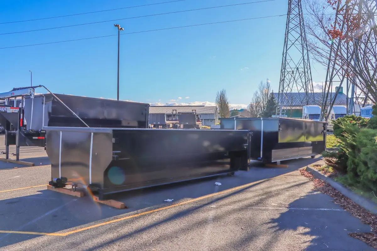 Roll-off dumpster ready for waste disposal at job site for Construction Dumpster Rental in College Place